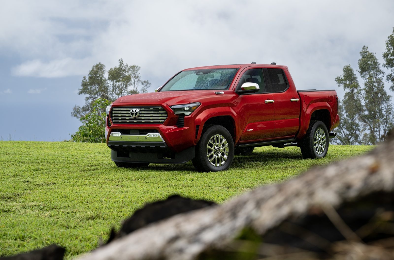Red 2026 Toyota Tacoma Limited parked on grass